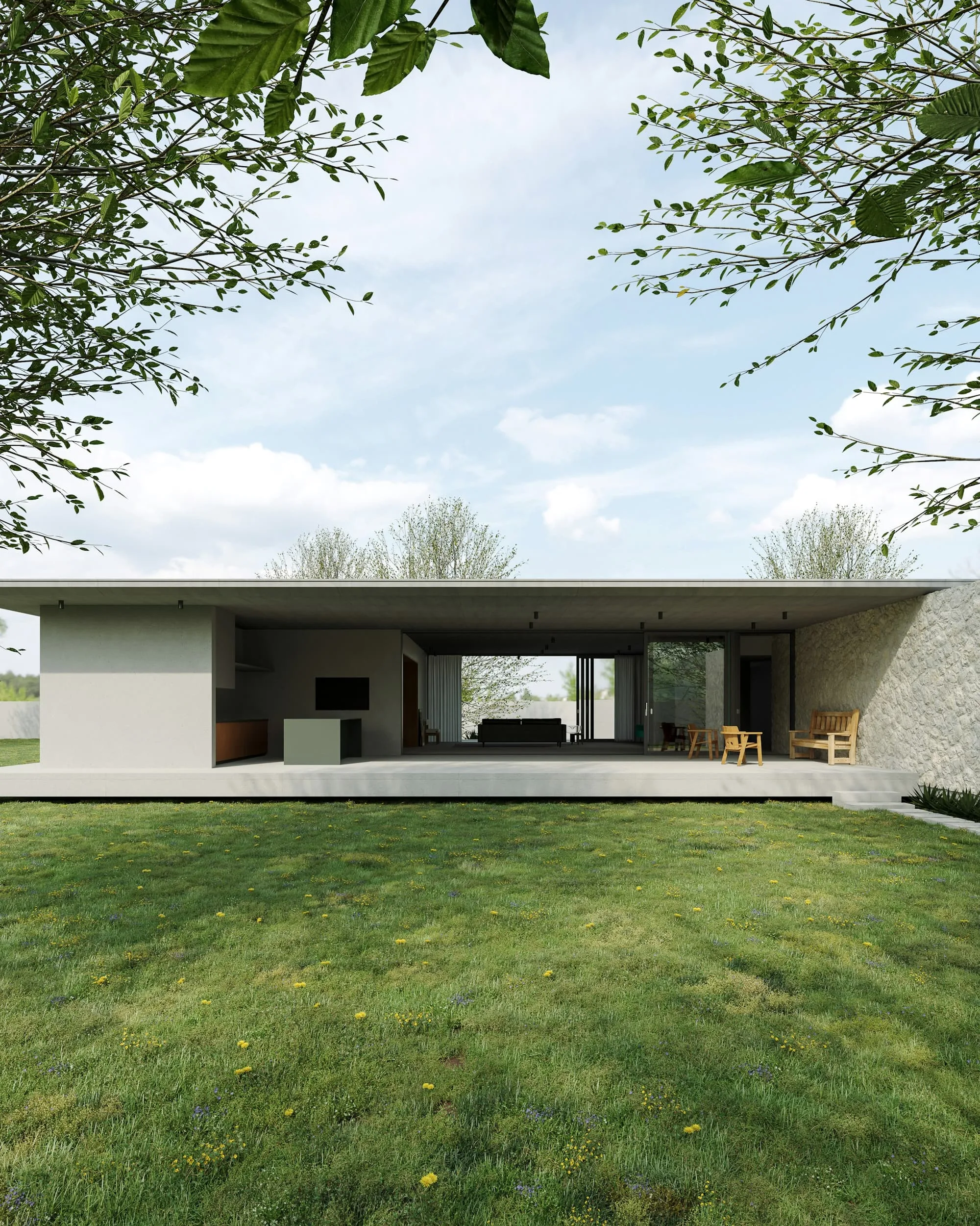 Low concrete pavilion open to a lawn, with the living space visible through full-height glazing