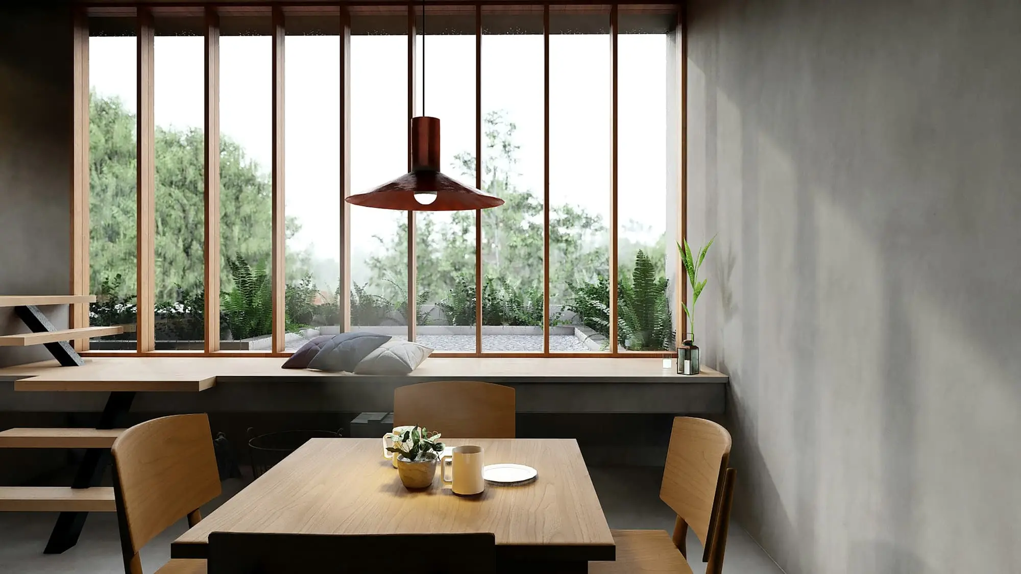 Dining nook with a window wall onto the garden and a bronze pendant
