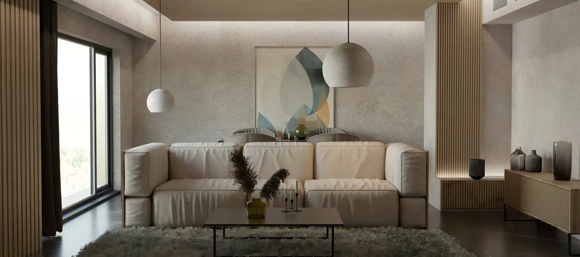 Living room with a deep cream sofa, pendant lights and a tonal plaster wall