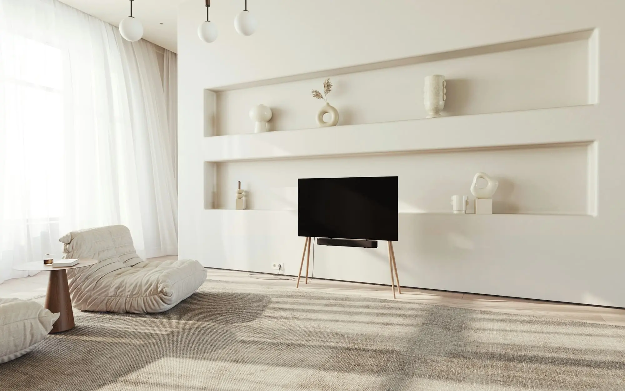 Plaster living room with sculpted wall niches, a low armchair and soft daylight